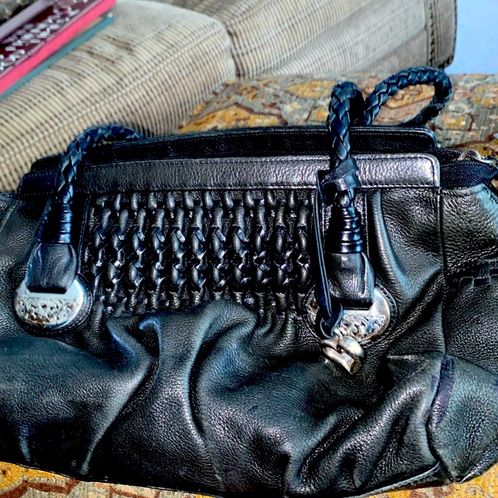 Brighton black pebble leather handbag with braided or woven handles.